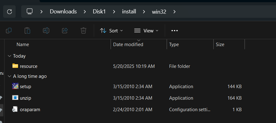 Windows Explorer showing setup.exe in the Disk1\install\win32 folder of the Discoverer installer